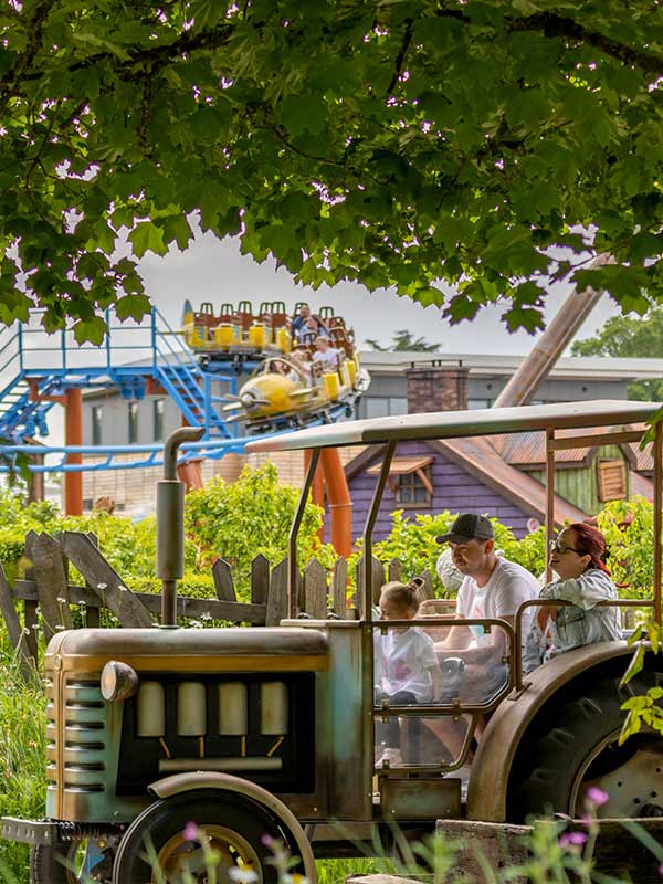 Family riding Trekking Tractors at Paultons Park