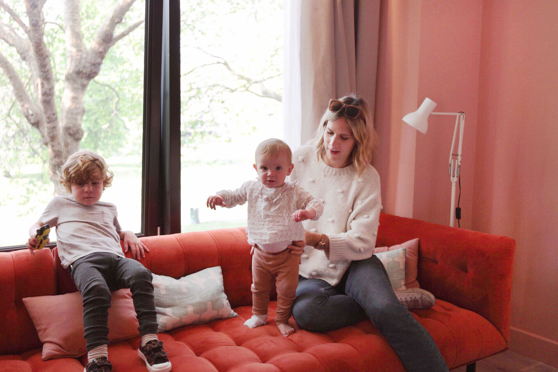 Family relaxing together in their hotel room