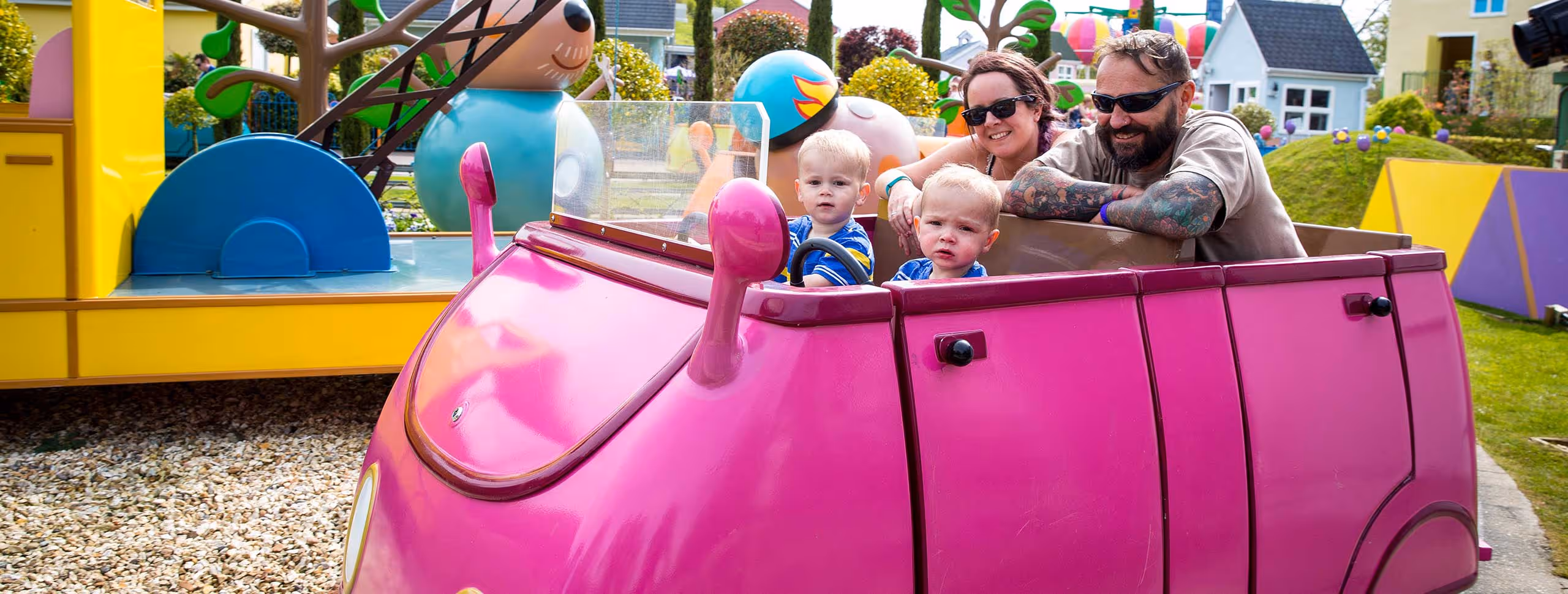 Family enjoying a ride together at Peppa Pig World