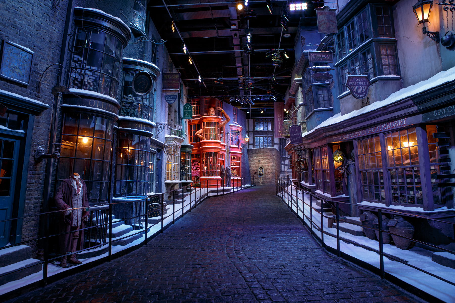 Snow-covered wizarding street during the winter feature